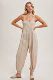 GAUZE SMOCKED BUTTON FRONT SHOULDER TIE JUMPSUIT