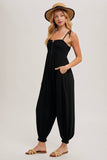 GAUZE SMOCKED BUTTON FRONT SHOULDER TIE JUMPSUIT