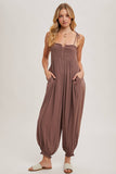 GAUZE SMOCKED BUTTON FRONT SHOULDER TIE JUMPSUIT