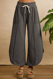 FRENCH TERRY OUT SEAM DETAIL TULIP HEM PANTS