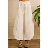 FRENCH TERRY OUT SEAM DETAIL TULIP HEM PANTS